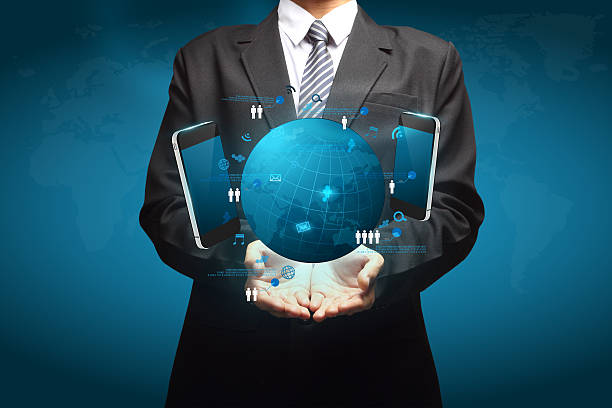 istock Holding globe and mobile phone social network 179078088