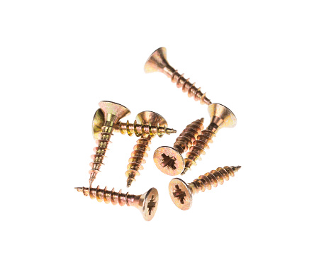 A group of anodized self-tapping screws. Close-up. Macro. Isolated over white background.