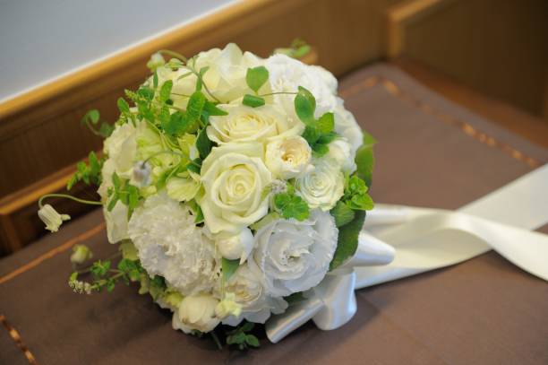 istock A bouquet held by a bride during a wedding ceremony. 1790783050