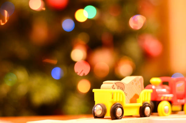 istock Wooden toy train, Christmas decorations in the background. 1790783075