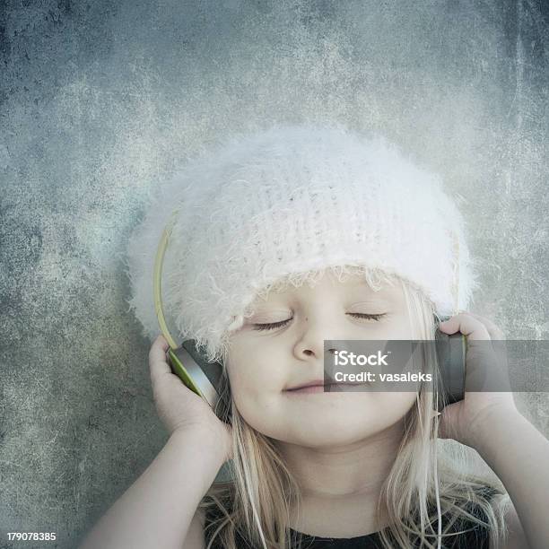 Cute Little Girl Enjoying Music Stock Photo - Download Image Now - Brown Hair, Carefree, Cheerful