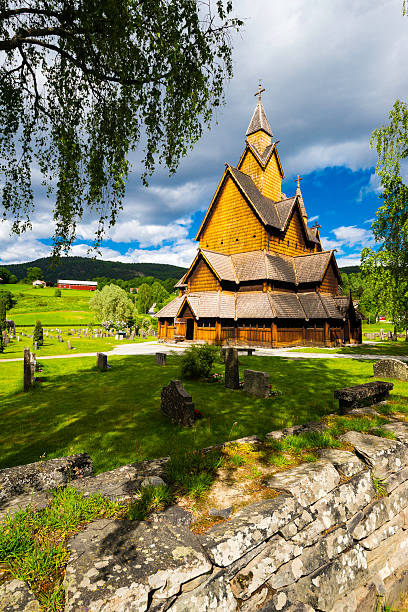The Stave Church in Heddal A view of the church in Heddal, his yard and cementary. heddal stock pictures, royalty-free photos & images