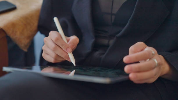 istock Young female freelancer working with digital device in the co-working space. 1790786929