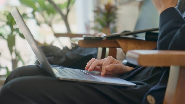 istock Young female freelancer working with digital device in the co-working space. 1790787503