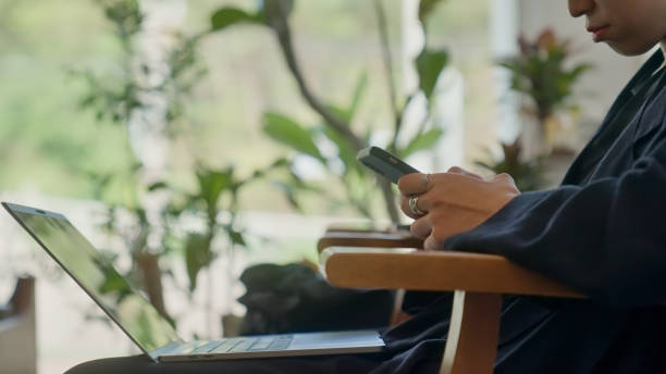 istock Young female freelancer working with digital device in the co-working space. 1790787605