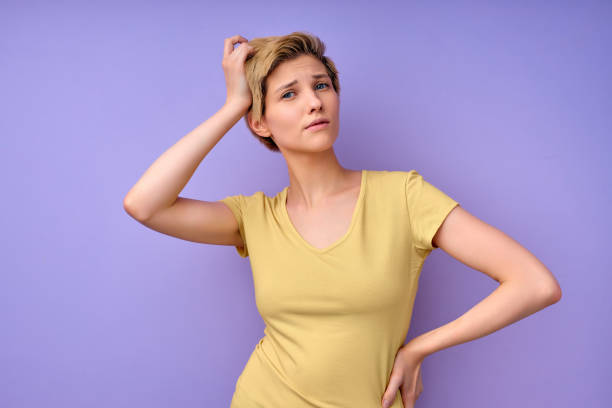 istock Confused short haired young female touching head having dilemma difficult choice 1790788084