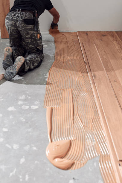 istock Professional handyman installing laminate flooring in a new apartment. 1790793479