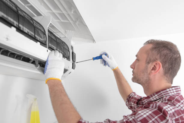 istock Service guy cleaning and maintaining air condition unit. 1790793975
