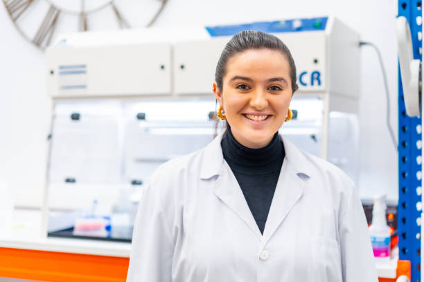 istock Young scientist standing smiling in a laboratory 1790796799
