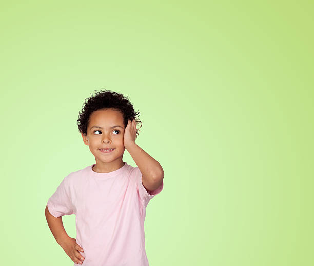 istock Pensive latin child isolated on green 179080413