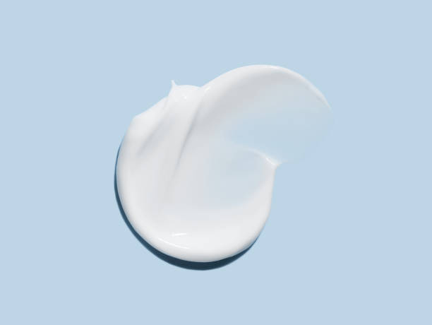 istock cosmetic smears cream texture on pastel blue background 1790805543