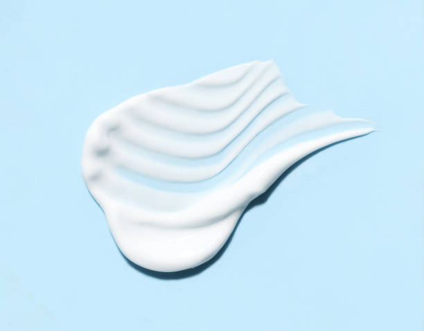 istock cosmetic smears cream texture on pastel blue background 1790807896