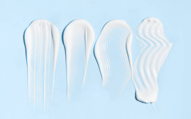istock cosmetic smears cream texture on pastel blue background 1790807937