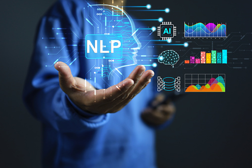 Natural language processing NLP concept with a man hand holding ai artificial intelligence and work on machine learning interface to communicate through applications