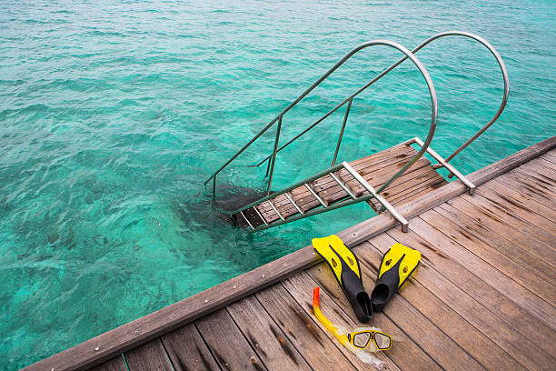 snorkel equipment on the jetty stock photo