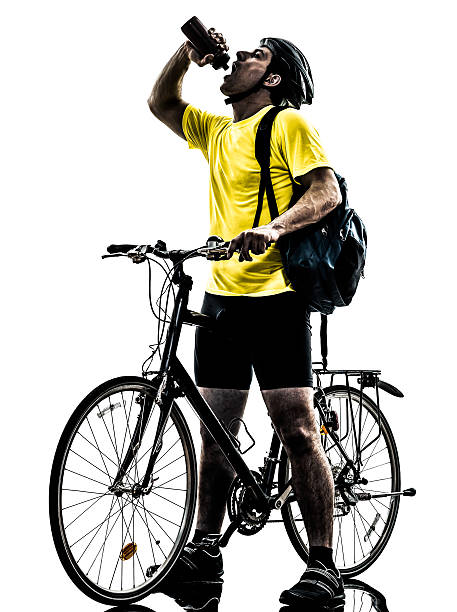 istock man bicycling  mountain bike drinking silhouette 179083218