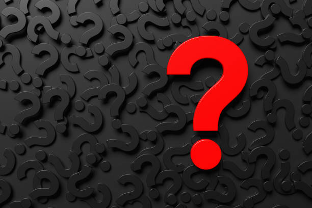 istock Big red question mark symbol on black background of many question marks. 1790833604