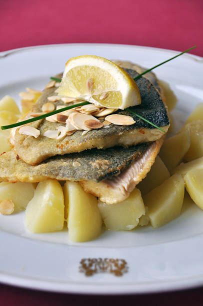 istock Pan fried trout fillets with potatoes 179083438