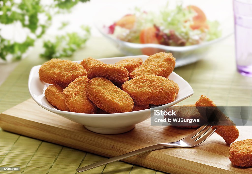 chicken nuggets  in a white bowl chicken nuggets served in a white bowl Chicken Nugget Stock Photo