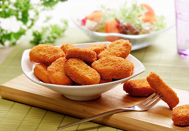 chicken nuggets  in a white bowl chicken nuggets served in a white bowl nugget photos stock pictures, royalty-free photos & images