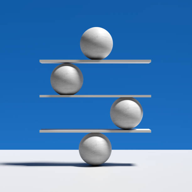 istock Harmony, balance, equilibrium and stability concepts. Spheres balancing on a seesaw. 1790836929