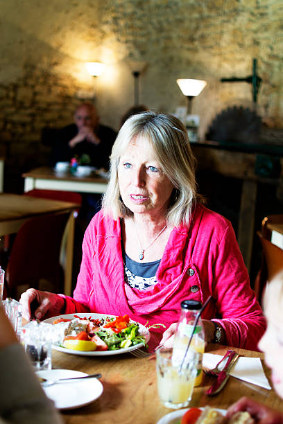 istock Mature woman in a restaurant 179083904