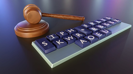 Close-up 3D rendering of a stenotype keyboard, also known as a shorthand keyboard or stenograph, with a court gavel