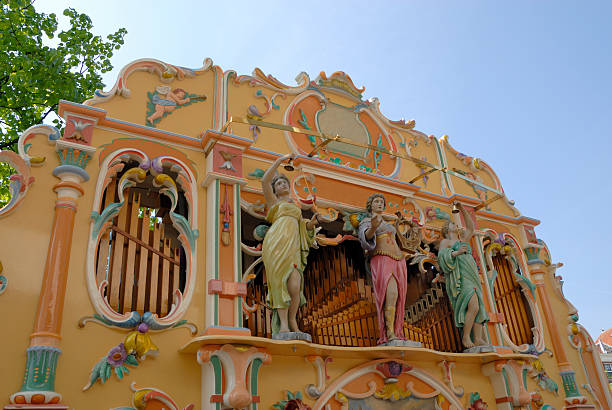 Street organ in Amsterdam Street organ playing at the street in Amsterdam hurdy gurdy stock pictures, royalty-free photos & images