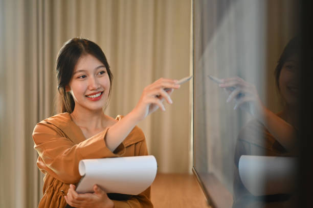istock Professional businesswoman giving presentation, explaining report investment graph chart data in meeting room 1790852100
