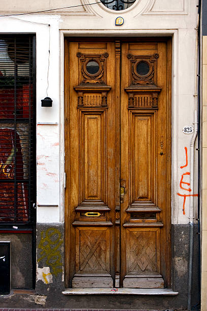 istock brown wood old door and a grate 179085428