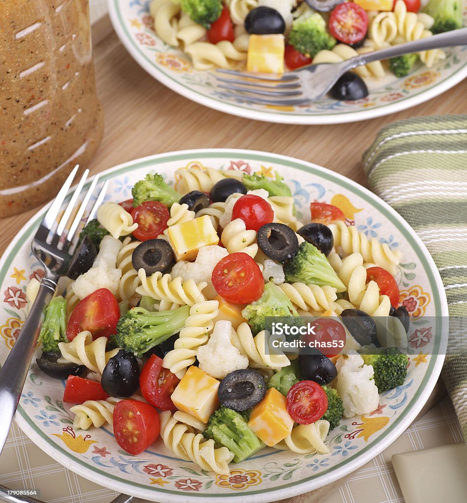 Pasta Salad Pasta salad with tomato, broccoli, black olives, cauliflower and cheese Cauliflower Stock Photo