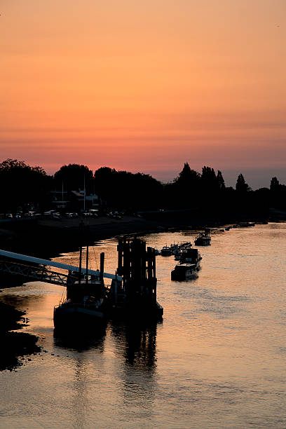 Sunset Over The River Thames "Sunset over the river Thames taken from Putney Bridge, London" putney photos stock pictures, royalty-free photos & images
