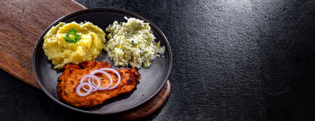 istock Chicken cutlet coated with breadcrumbs with potatoes and cabbage 1790865988