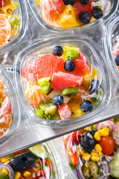 istock Boxes with pre-packaged fruit salads in a commercial fridge 1790869206