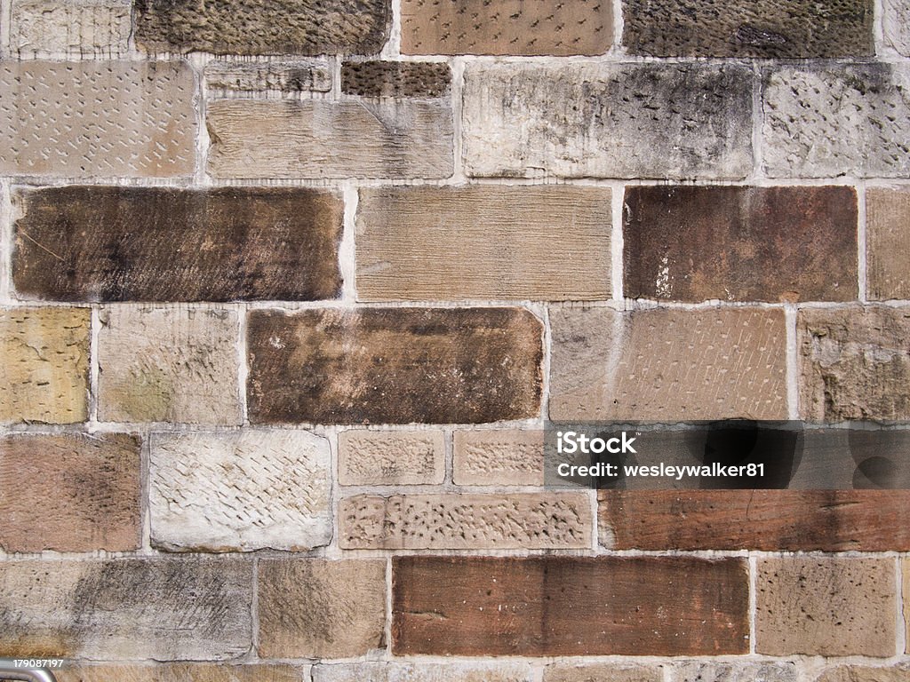 Convict built sandstone wall Horizontal image of sandstone blocks that were made by convicts in the Australian penal colony, located in Parramatta. Australia Stock Photo