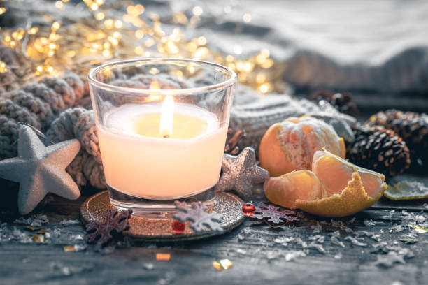 istock Cozy Christmas composition with a burning candle and decorative details. 1790873779