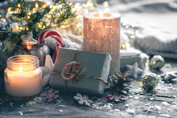 istock Cozy Christmas composition with a burning candle and decorative details. 1790873784