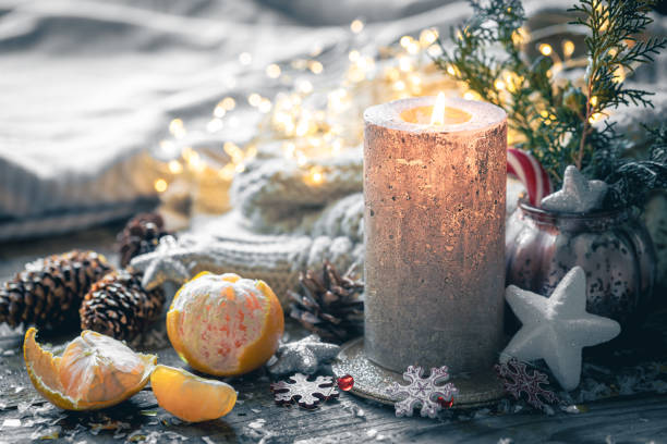istock Cozy Christmas composition with a burning candle and decorative details. 1790873788