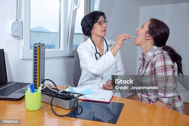 Female Doctor Examining Her Patient Stock Photo - Download Image Now - Thyroid Exam, 30-39 Years, Adult