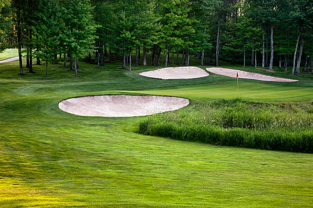 istock Golf green and white sand bunkers 179087856