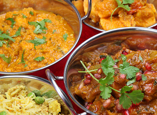 istock Indian curries in silver dishes with coriander garnish 179088463