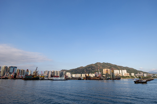 Hong Kong - November 12, 2023 : General view of the Tuen Mun Typhoon Shelter in Tuen Mun, New Territories, Hong Kong. A typhoon shelter, is used by small to medium ships as a shelter against gale-force winds and rough seas during a typhoon strike.