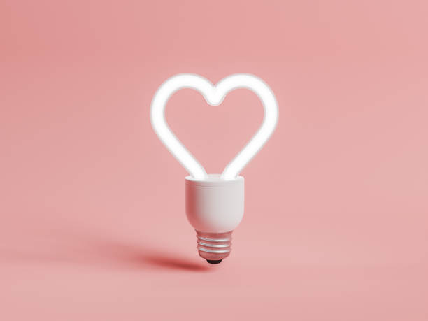 istock Heart-Shaped LED Bulb on Pink Background 1790890661