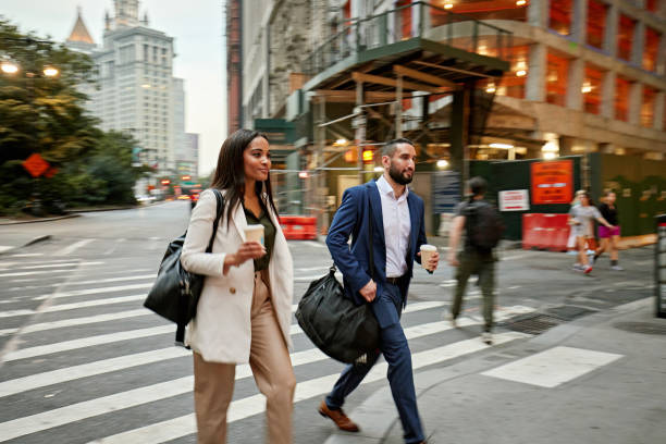 istock NYC colleagues crossing street after work 1790895206