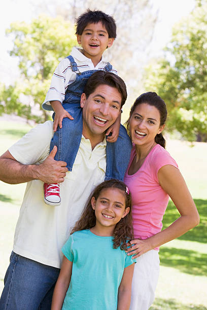 istock Family outdoors smiling 179090009