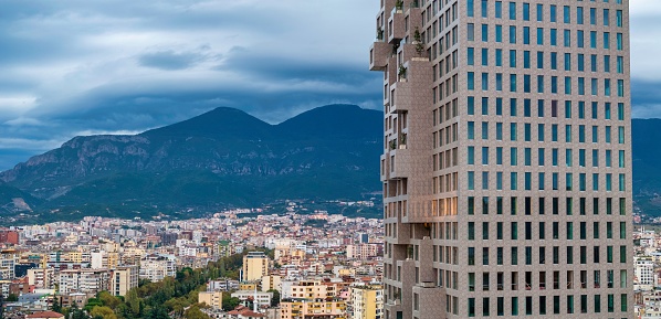 The skyline of Tirana city and the cloudy sky