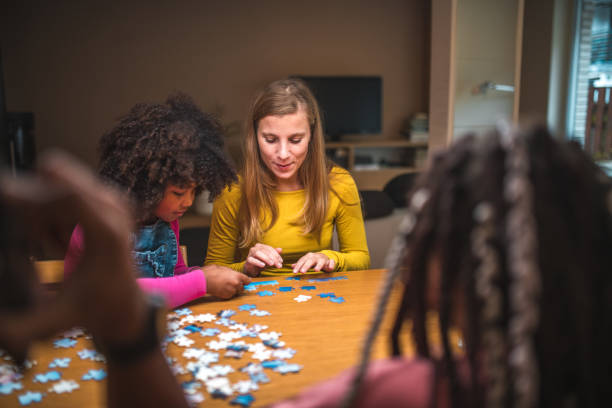 istock Mixed Race Family Enjoying Puzzle Time 1790901258