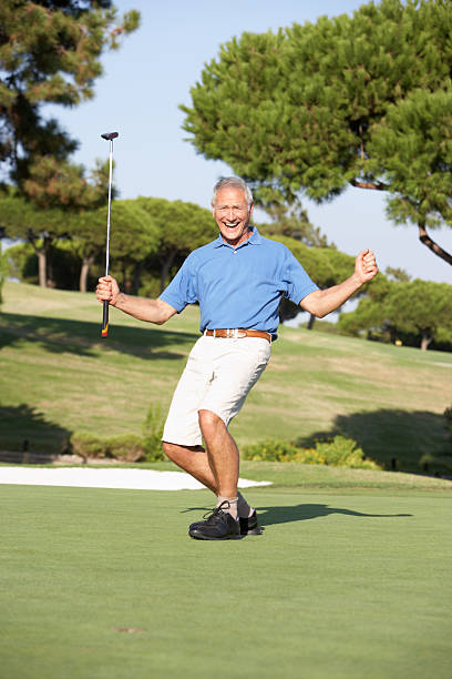 istock Senior Male Golfer On Golf Course Putting Green 179090184