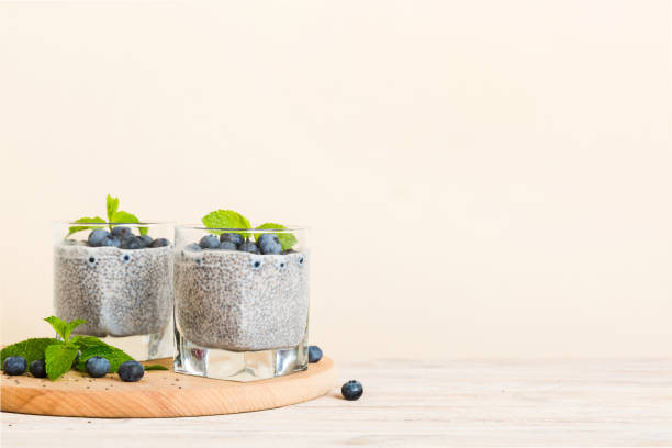 istock Healthy breakfast or morning with chia seeds vanilla pudding and blueberry berries on table background, vegetarian food, diet and health concept. Chia pudding with coconut milk and blueberry 1790906464