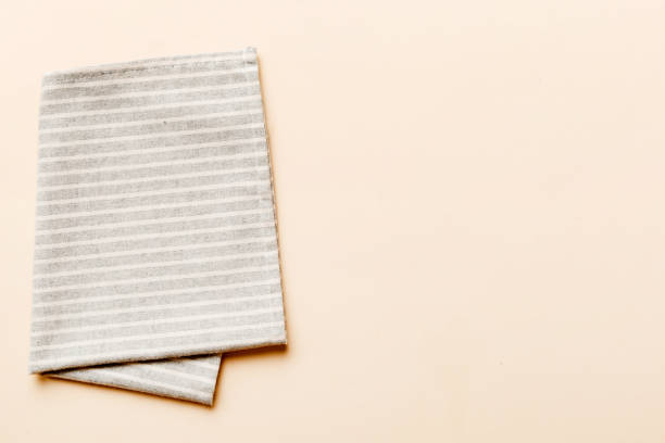istock top view with gray kitchen napkin isolated on table background. Folded cloth for mockup with copy space, Flat lay. Minimal style 1790906481
